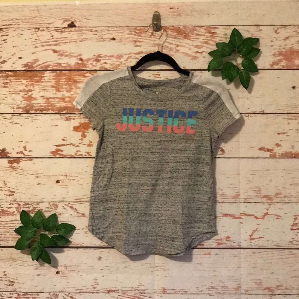 A grey justice shirt.
